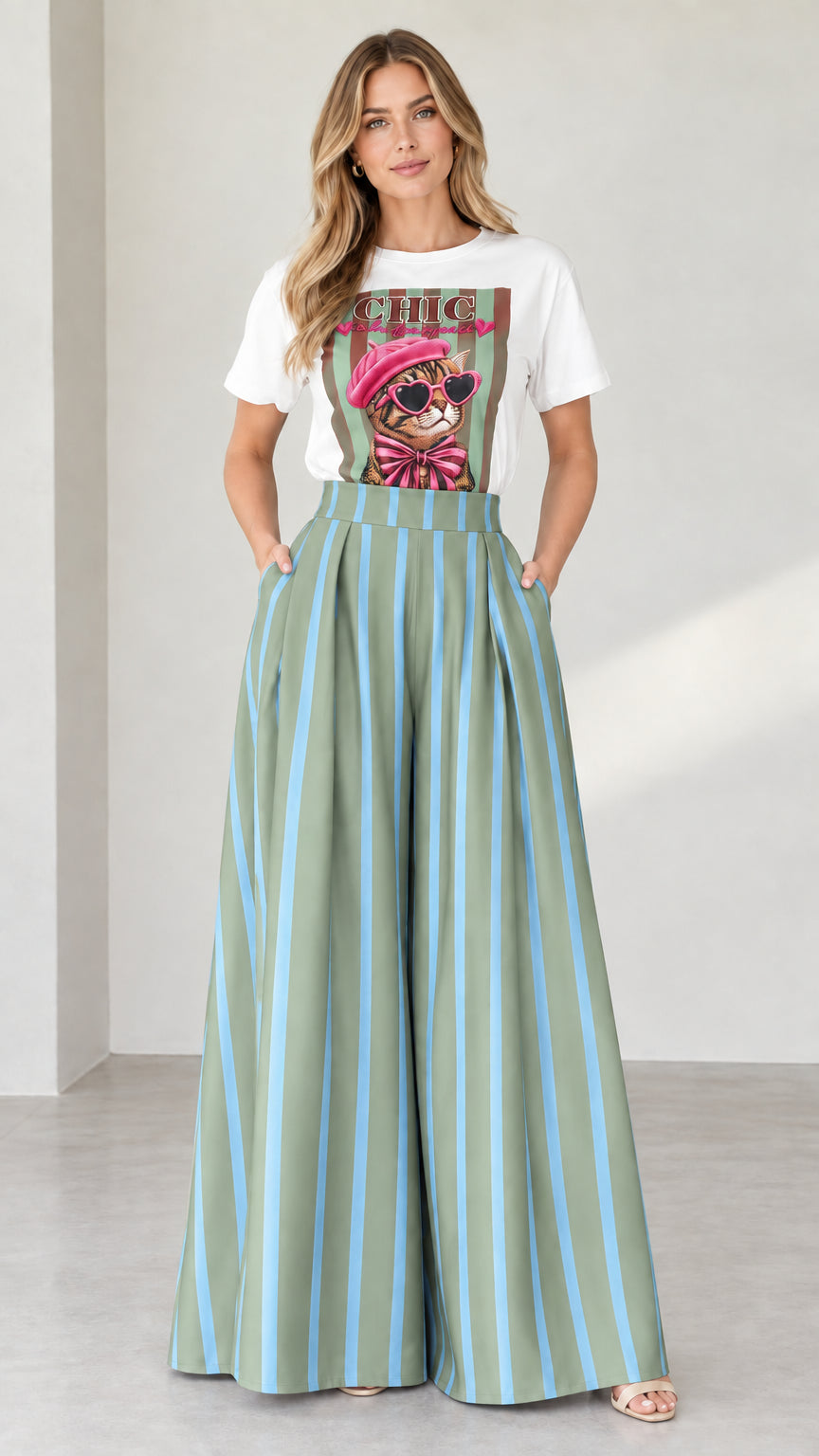 Full-length shot of white graphic tee and sage green striped wide-leg pants set