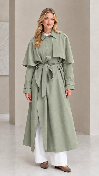 Front view of sage green capelet longline belted trench coat