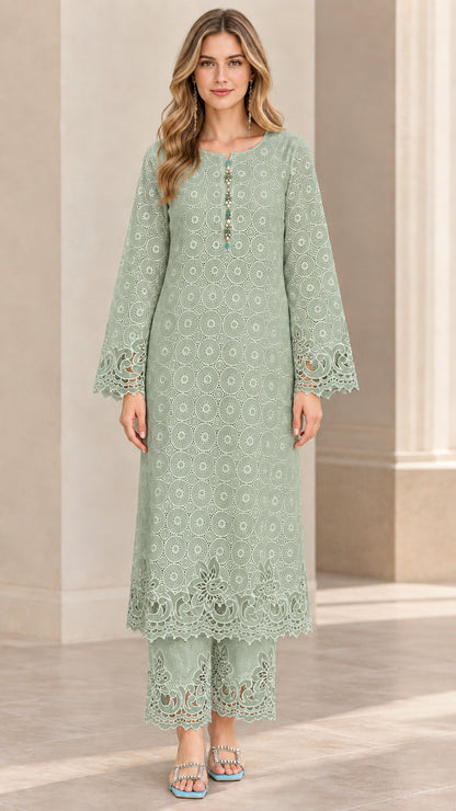 Front view of woman wearing sage green embroidered longline kurta top and matching cropped trousers