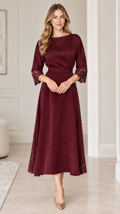 Full front view of rich burgundy belted A-line midi dress with lace accents