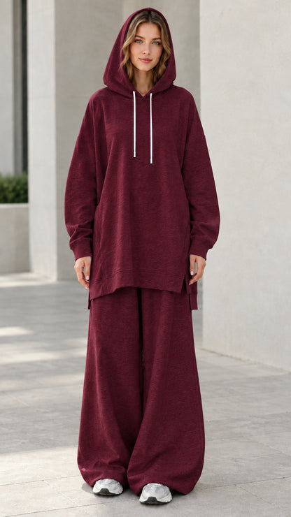 Woman wearing deep burgundy wine oversized hoodie and relaxed wide-leg lounge pants set