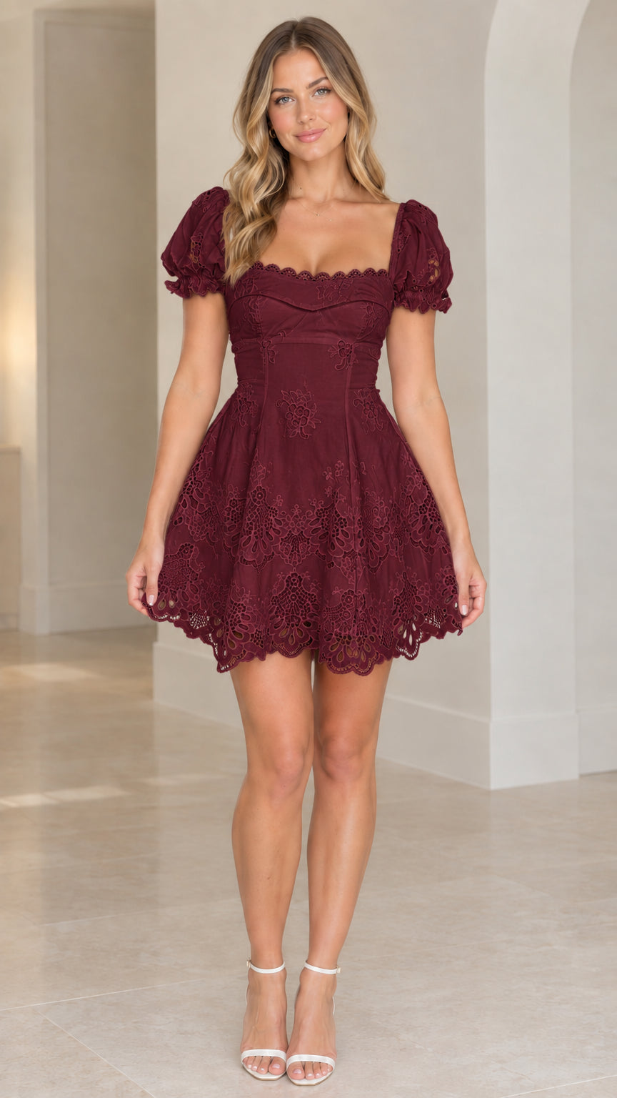 Front view of model wearing burgundy wine sweetheart eyelet mini dress