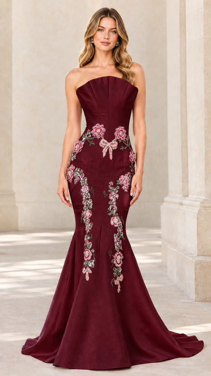 Front view of burgundy strapless floral embroidered mermaid evening dress