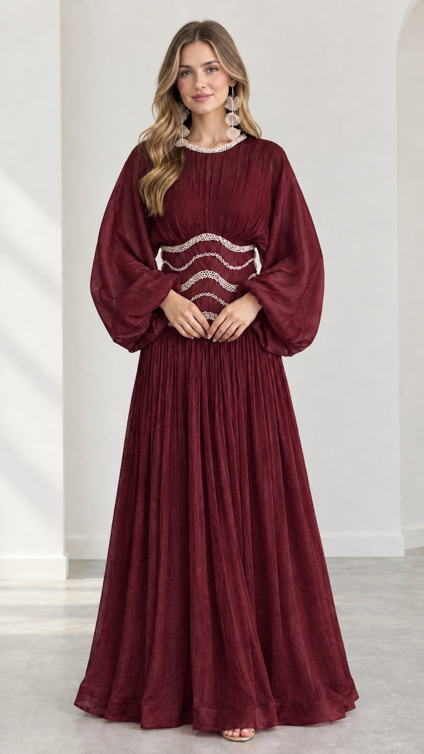 Model wearing burgundy red pleated evening maxi gown