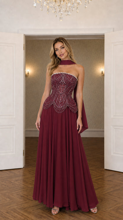 Burgundy beaded corset evening gown with matching neck scarf drape
