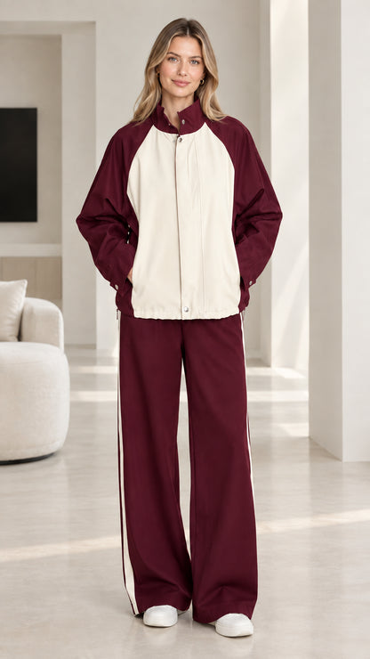 Burgundy red and cream colorblock two-piece tracksuit set on model