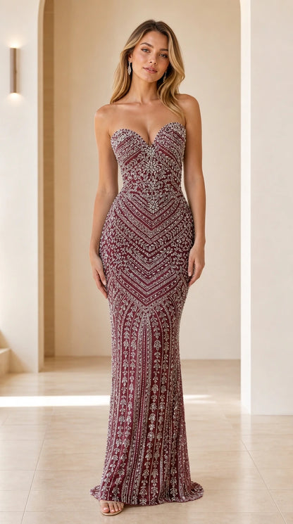 Model wearing Burgundy wine strapless sweetheart formal gown