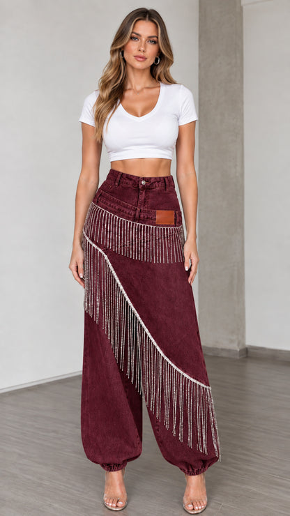 Front view of model wearing burgundy wine red rhinestone fringe denim balloon pants