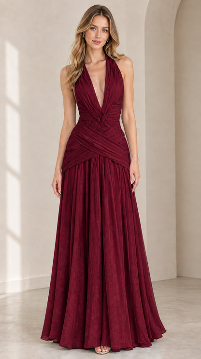 Front view of burgundy pleated plunge halter maxi dress