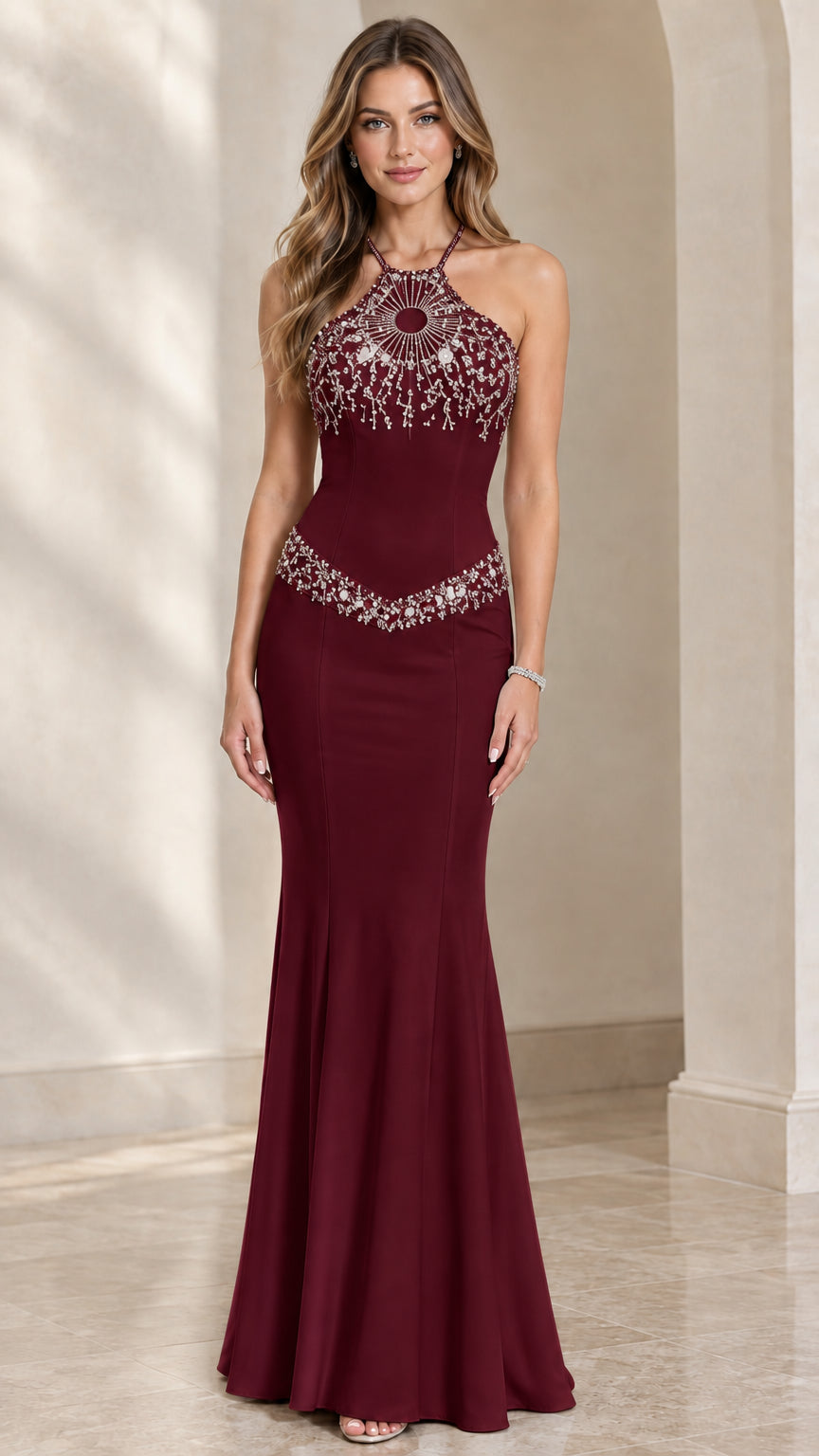 Model wearing burgundy red beaded halter neck mermaid evening gown