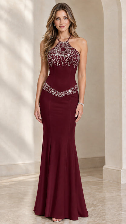 Model wearing burgundy red beaded halter neck mermaid evening gown