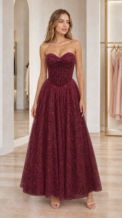 Front view of burgundy strapless glitter tulle formal evening dress