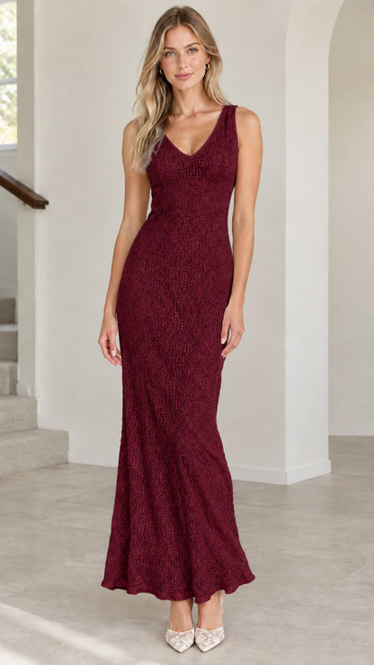 Front view of model wearing burgundy sleeveless lace floor-length gown