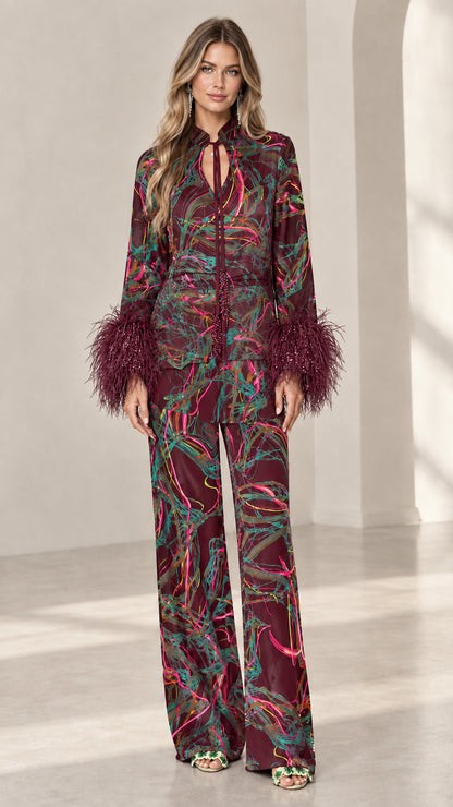Full-length view of Burgundy feather cuff printed satin pant set