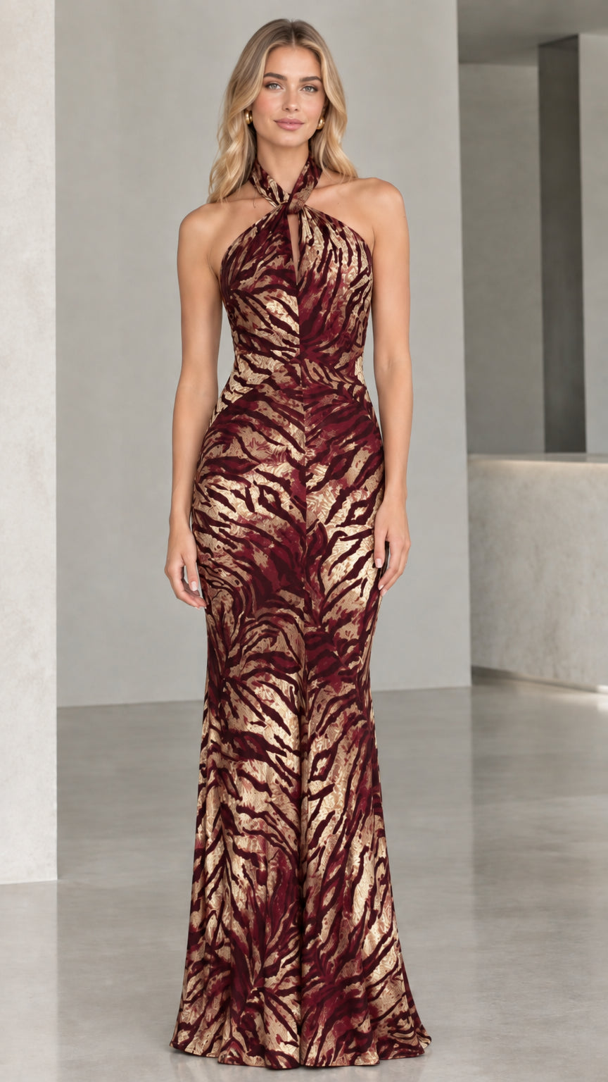 Model wearing Burgundy and gold metallic shimmer halter evening gown