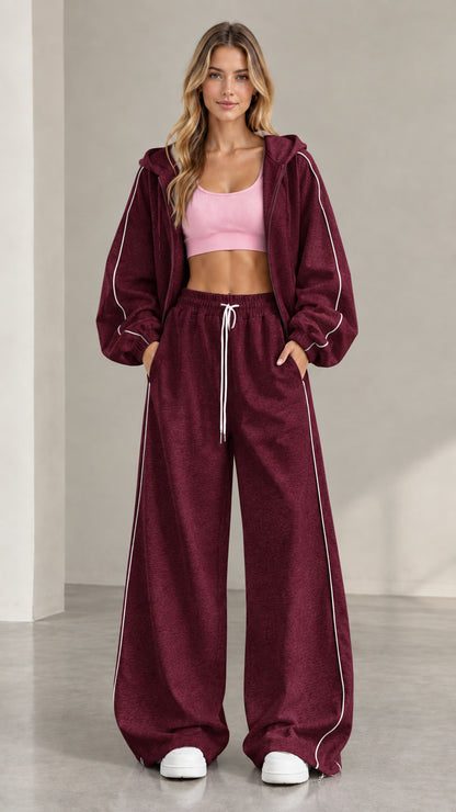 Model wearing Burgundy two-piece zip-up hoodie and sweatpants set