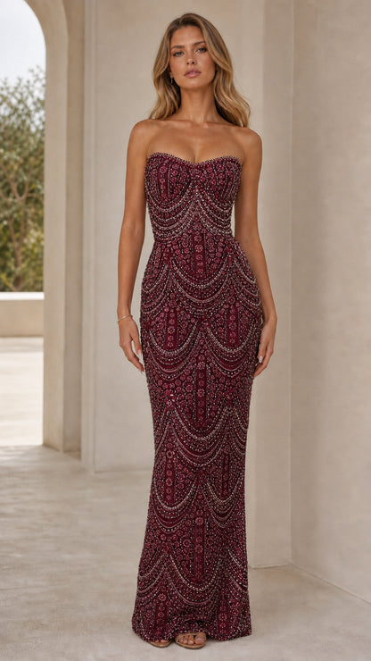 Front view of model wearing burgundy wine beaded sweetheart strapless gown