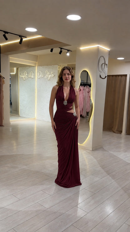 Front view of model wearing Burgundy wine halter ruched formal gown