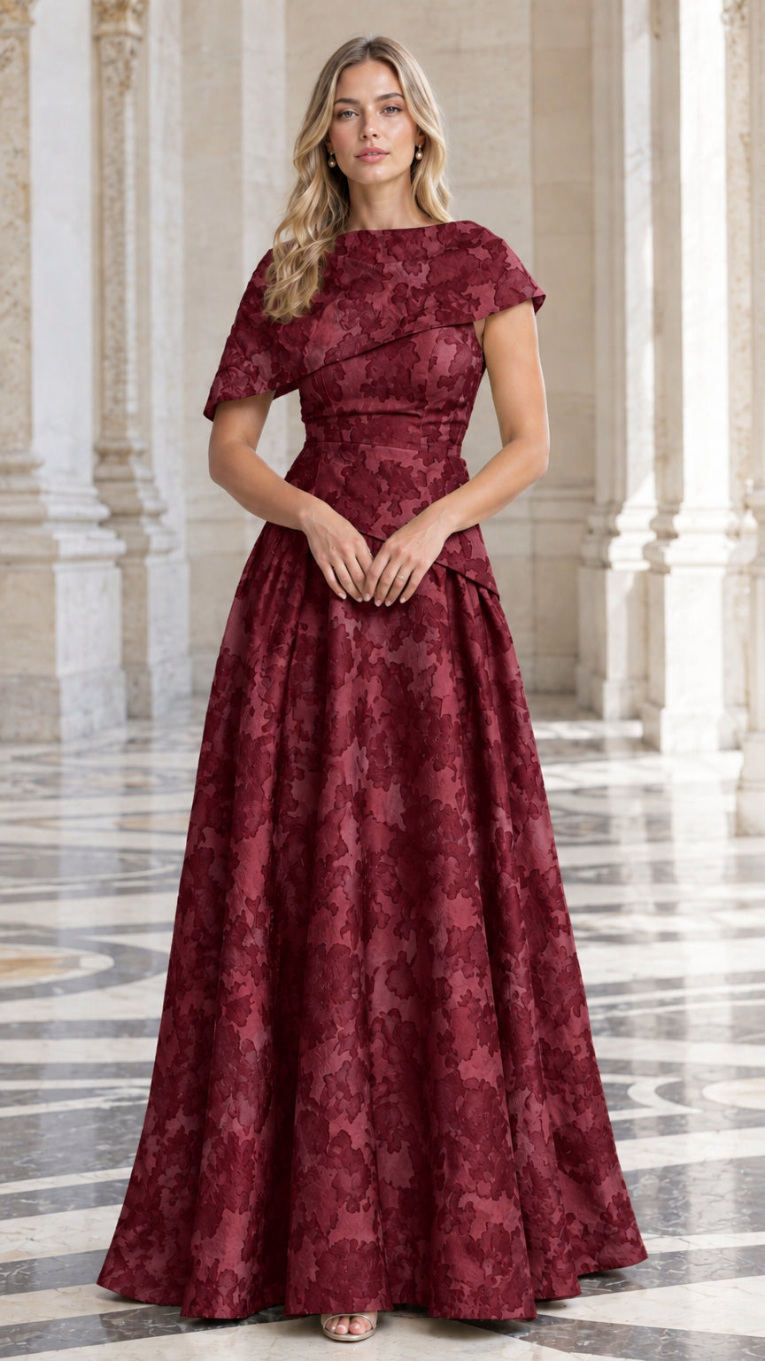 Model wearing Burgundy floral jacquard asymmetric capelet evening dress