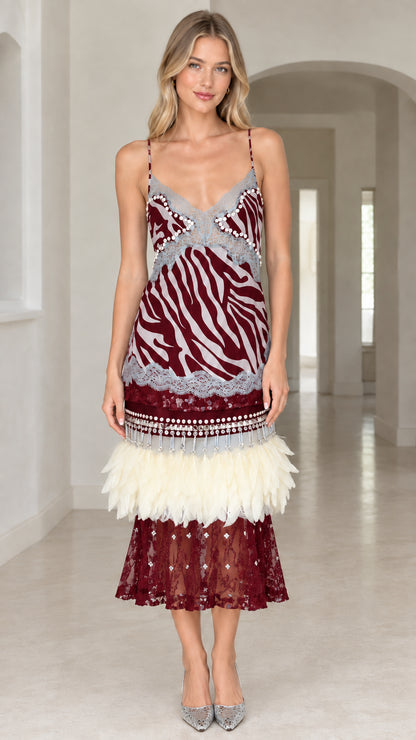 Model wearing Burgundy zebra print feather trimmed slip midi dress