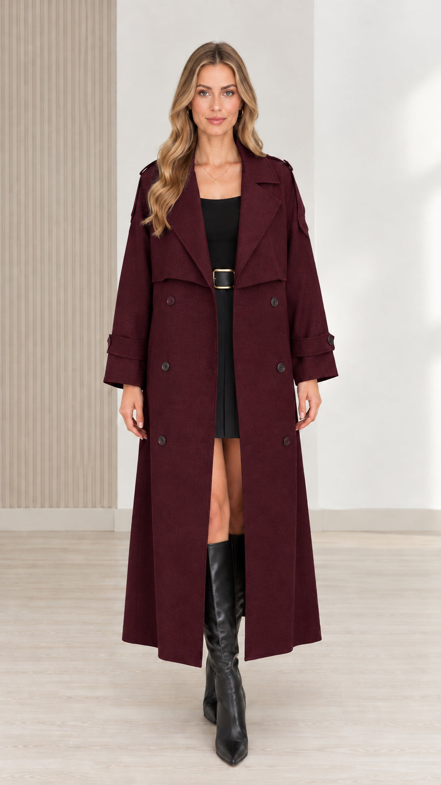Front view of women's burgundy maxi trench coat