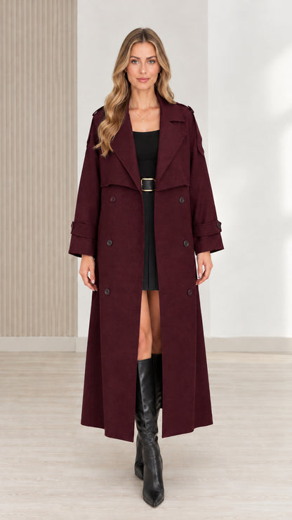 Front view of women's burgundy maxi trench coat