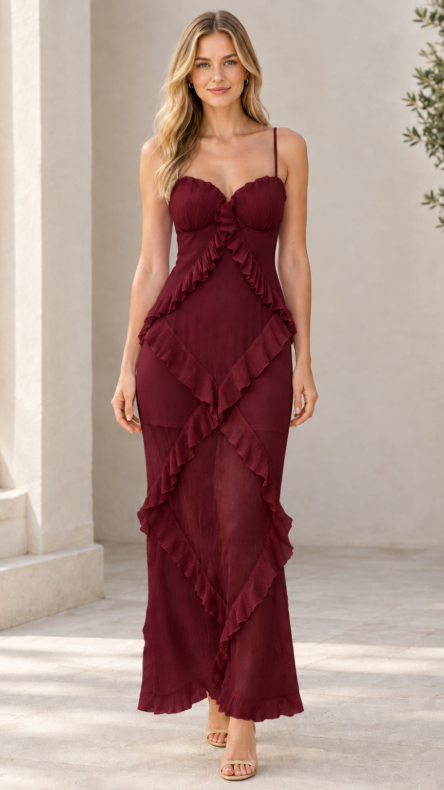 Front view of model wearing burgundy sweetheart cascading ruffle cami maxi dress