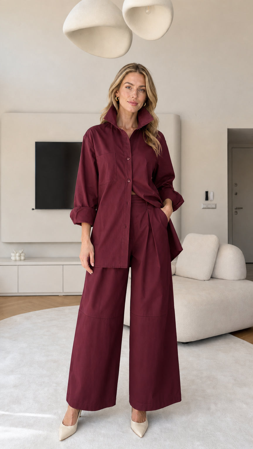 Front view of women's matching button-down shirt and wide-leg trousers set in Burgundy
