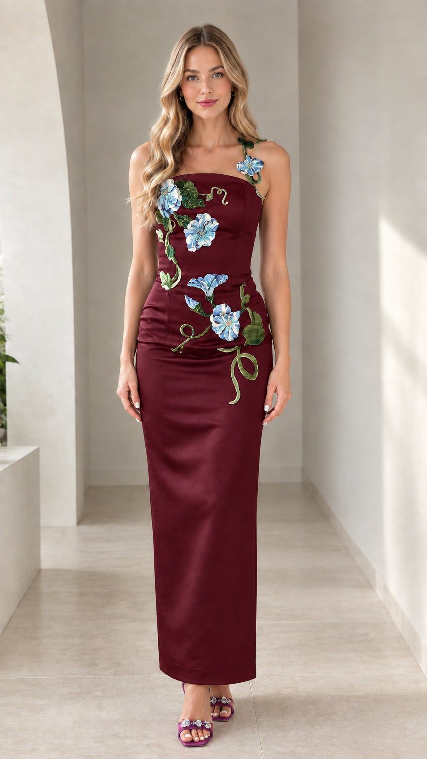 Model wearing burgundy wine satin maxi gown with 3D embroidered flowers