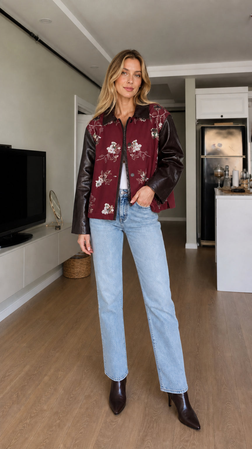 Full-body front view of model wearing burgundy floral embroidered contrast sleeve jacket