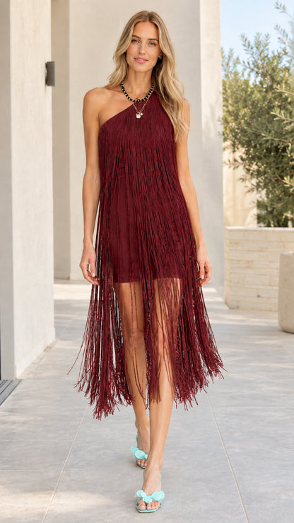 Woman wearing burgundy wine red one-shoulder fringe midi dress