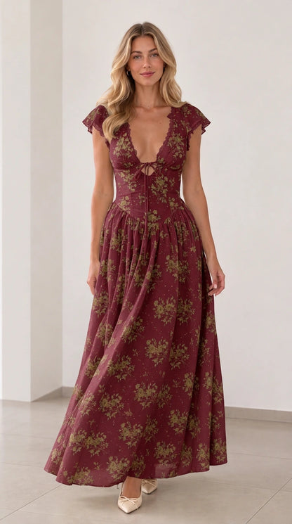 Front view of woman wearing burgundy floral plunging tie-front maxi dress