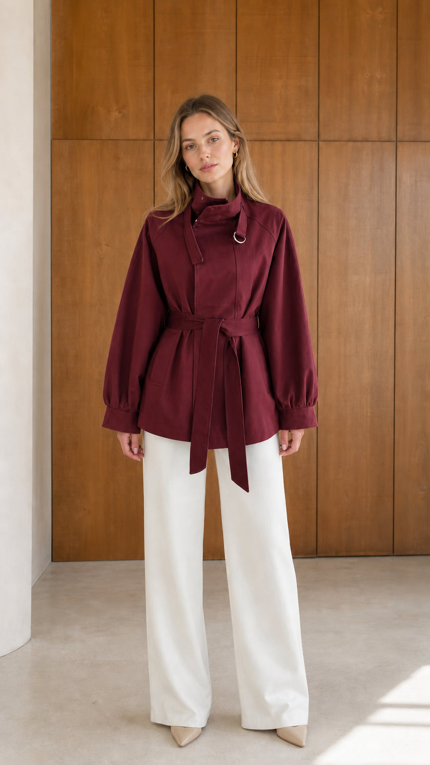 Model wearing burgundy wine red high neck belted short trench jacket