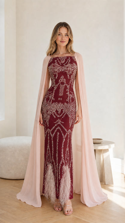 Front view of the Burgundy red sequin embroidered gown with contrast cape