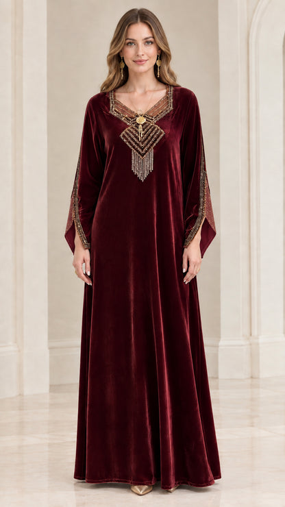 Front view of burgundy wine red velvet kaftan maxi gown with tassel detail