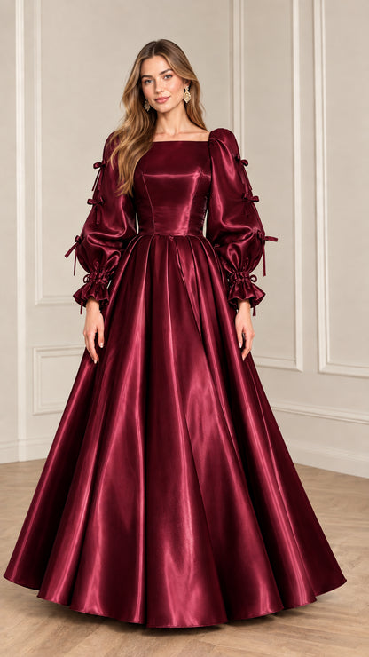 Full-length front view of model wearing Burgundy wine red satin puff sleeve ball gown