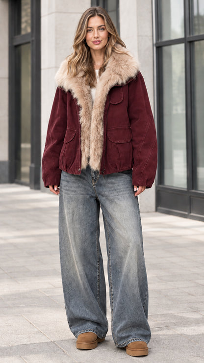 Full front view of model wearing burgundy faux fur trim winter jacket