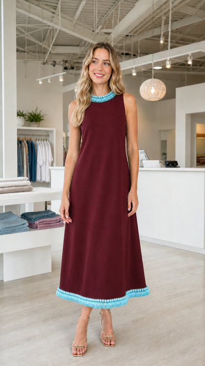 Front view of burgundy sleeveless midi dress with turquoise beaded trim
