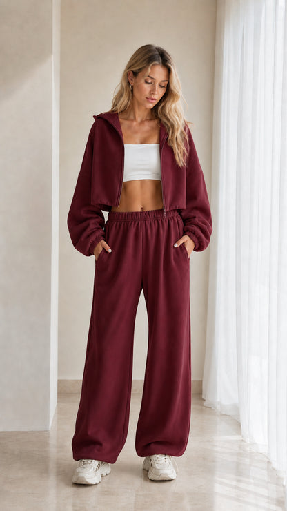 Model wearing burgundy red 2-piece cropped hoodie and wide leg sweatpants set
