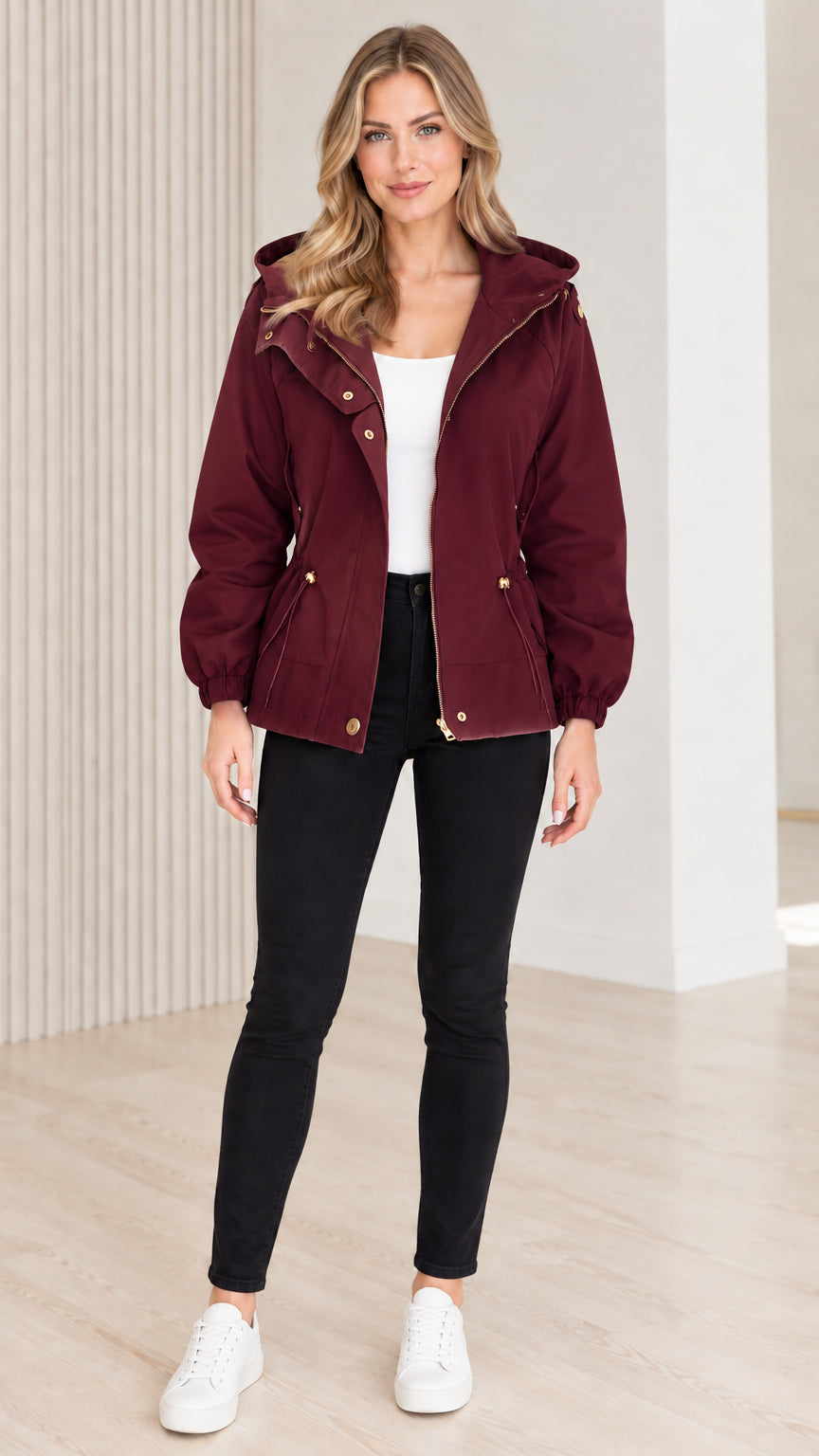 Front view of model wearing burgundy wine red hooded drawstring utility jacket