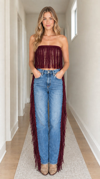 Front view of model wearing burgundy red strapless fringe crop top