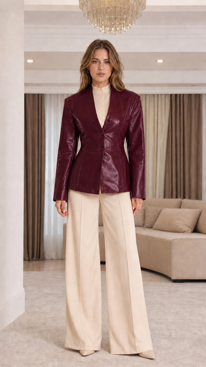 Front view of model wearing Burgundy wine faux leather blazer
