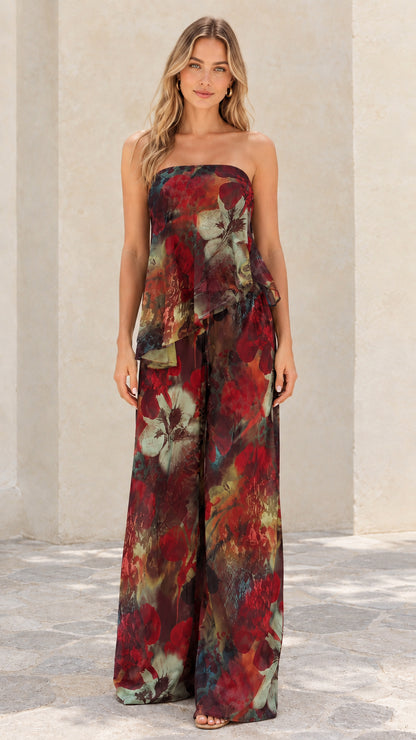Front view of burgundy multi floral strapless tiered wide-leg two-piece set