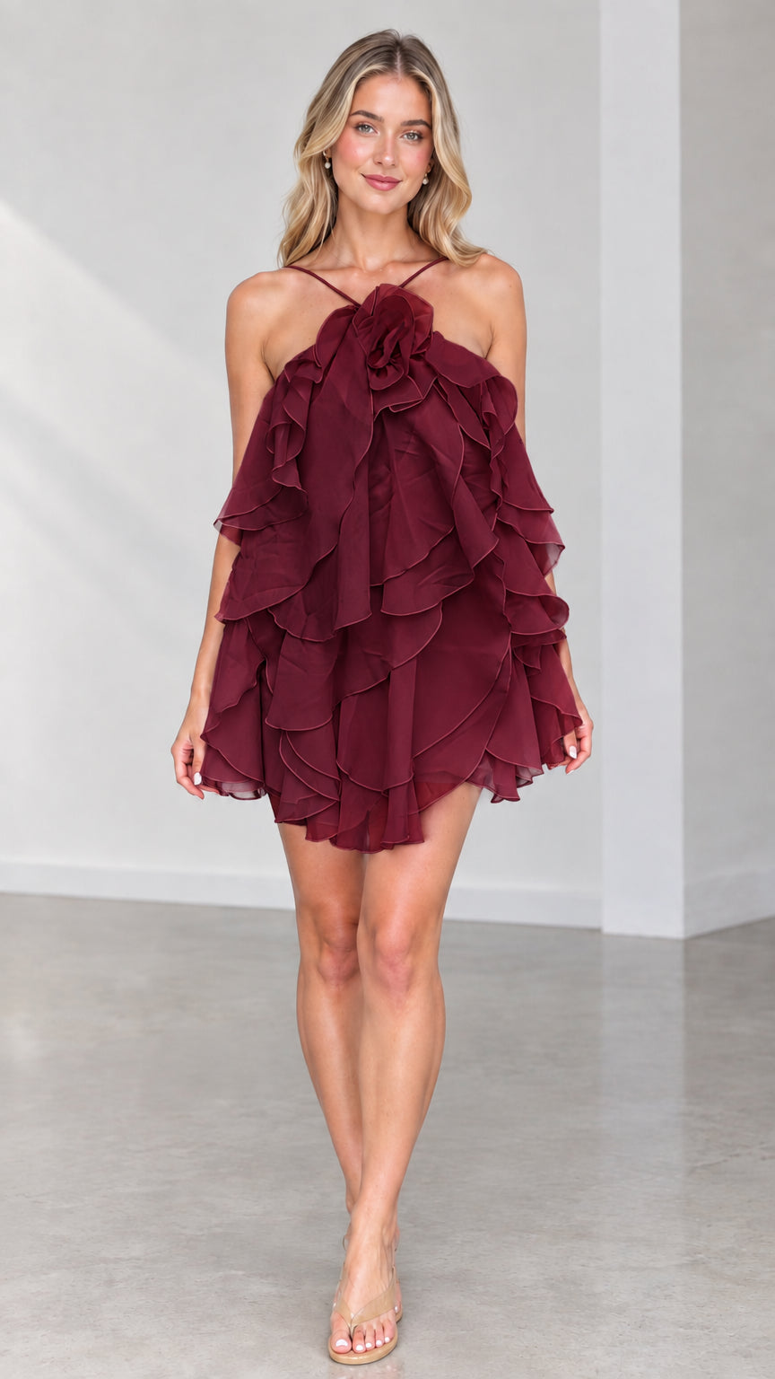 Front view of model wearing Burgundy wine tiered ruffle halter mini dress