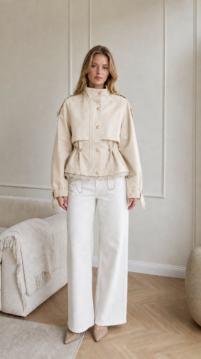 Model wearing beige cream cropped utility jacket with adjustable waist