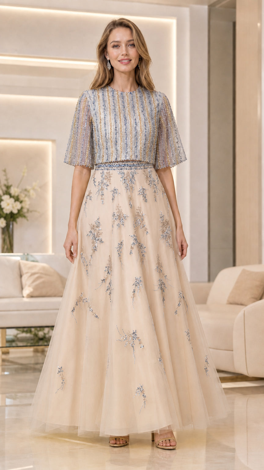 Model wearing champagne beaded flutter-sleeve tulle evening gown