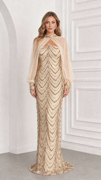 Front view of champagne gold sequined evening dress with sheer champagne capelet