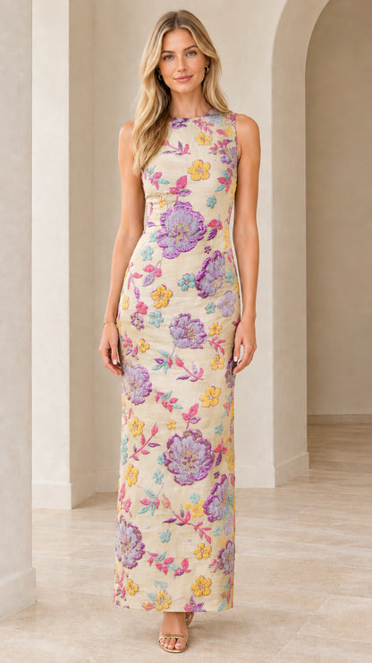 Front view of woman wearing cream floral embroidered sleeveless column maxi dress