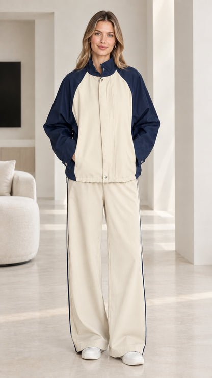 Beige and navy blue colorblock two-piece tracksuit set on model