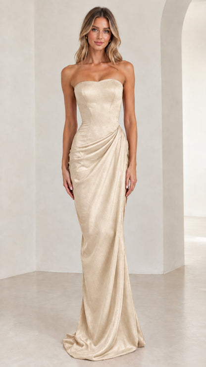 Model wearing shimmering champagne gold strapless draped maxi dress